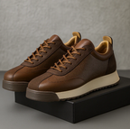 Low-top lace-up trainers with textured side panels and flat soles