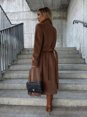 Women's long belted double-breasted coat with notched lapels and flap pockets