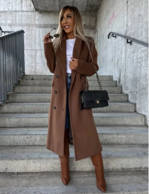 Women's long belted double-breasted coat with notched lapels and flap pockets