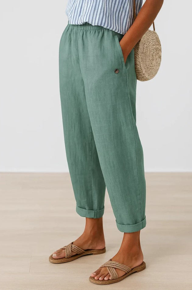 Women's plain cropped trousers with elasticated waist, side pockets and turn-up cuffs