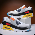 Low-top lace-up air cushion trainers with layered panels and visible air-style sole window