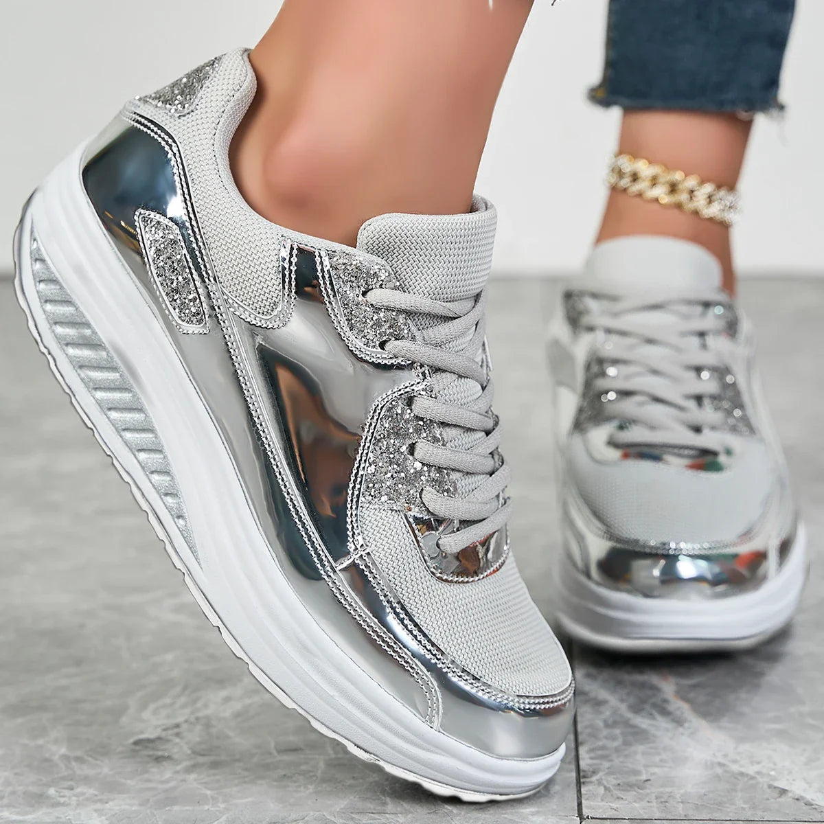 Women's embellished lace-up sneakers with metallic panels and layered platform soles