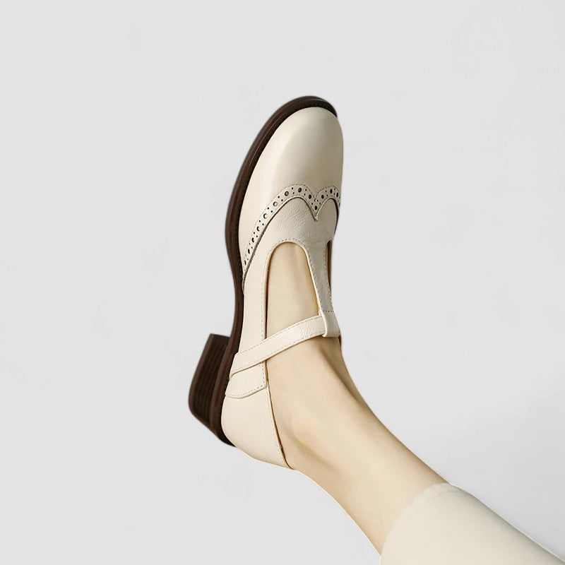 Women's Mary Jane shoes with buckle straps, perforated toe detailing and low block heels
