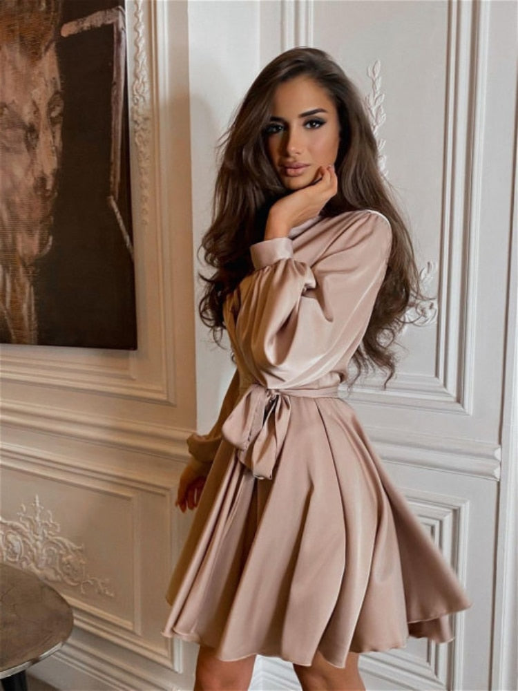 Women's long-sleeved wrap mini dress with a tie waist and flared skirt