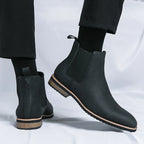 Men's Chelsea boots with elastic side panels, pull tabs and low heels