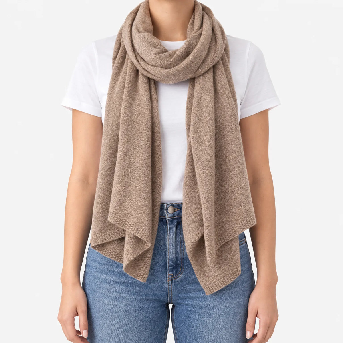 Women's long plain scarf with ribbed edges worn in a draped wrap