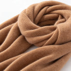 Women's long plain scarf with ribbed edges worn in a draped wrap