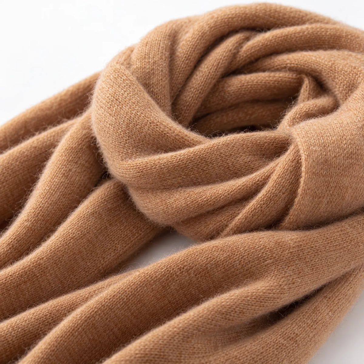 Women's long plain scarf with ribbed edges worn in a draped wrap