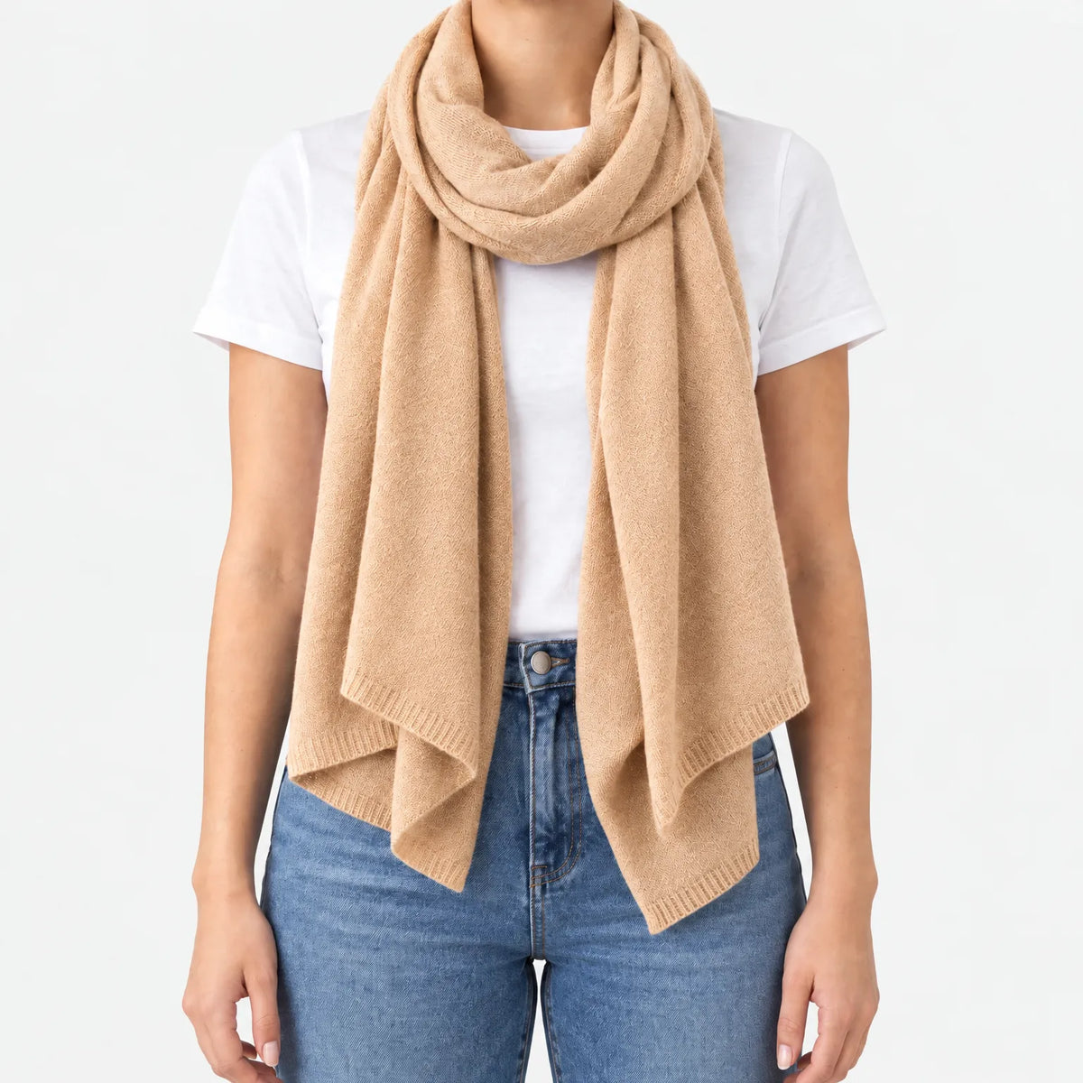 Women's long plain scarf with ribbed edges worn in a draped wrap