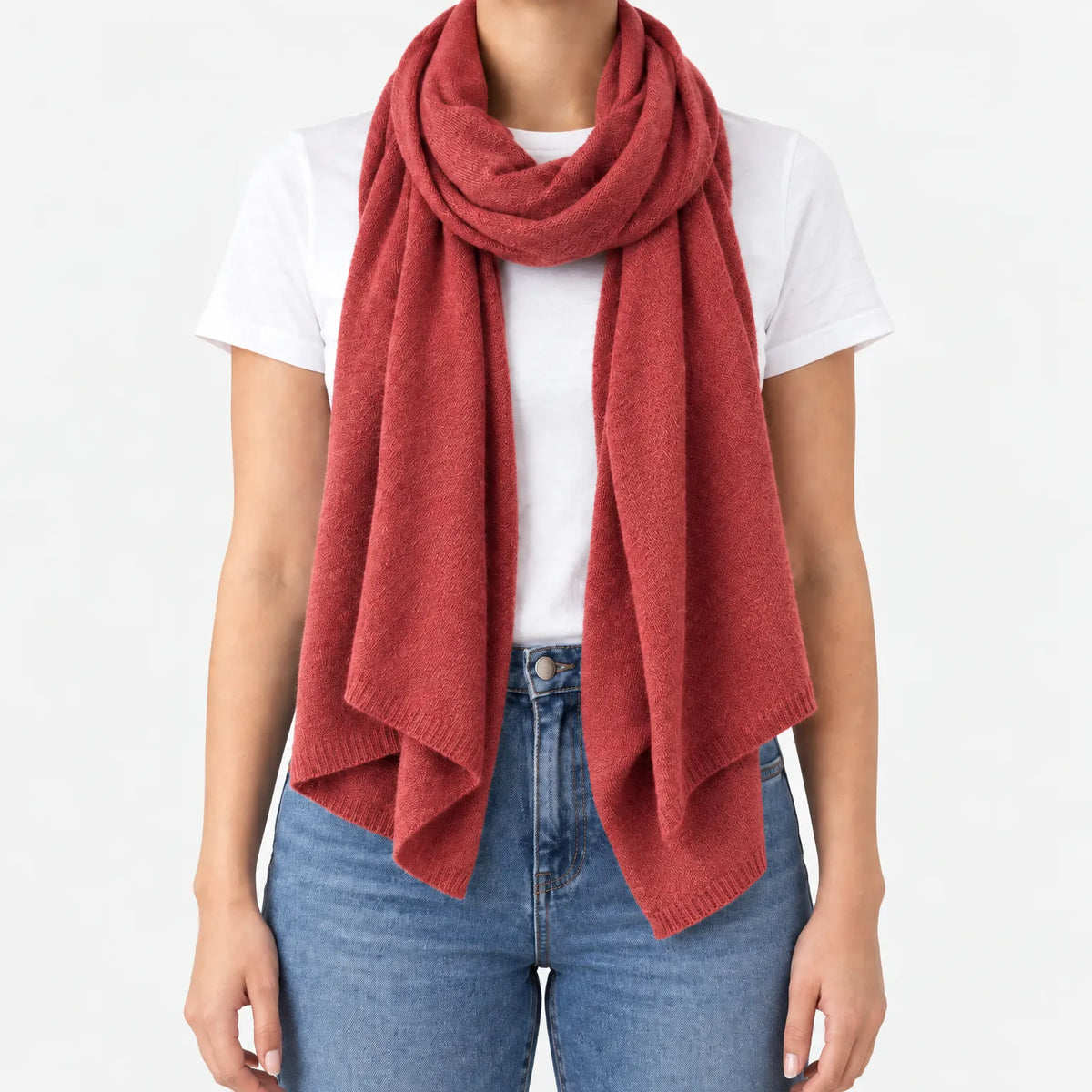 Women's long plain scarf with ribbed edges worn in a draped wrap