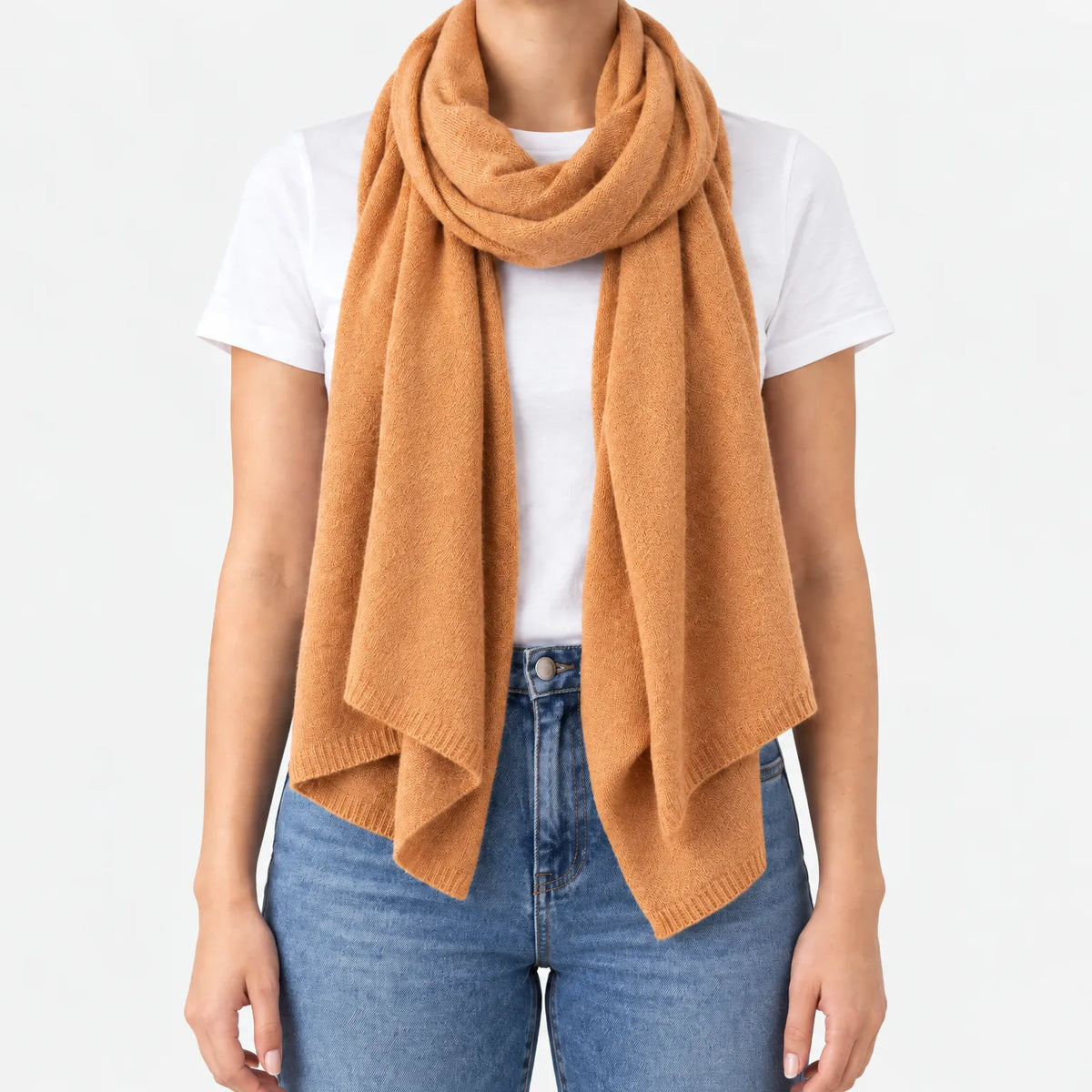Women's long plain scarf with ribbed edges worn in a draped wrap
