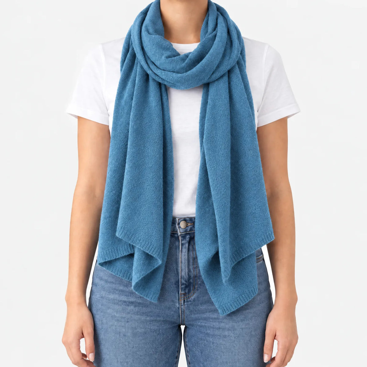 Women's long plain scarf with ribbed edges worn in a draped wrap