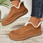 Women's slip-on loafers with moc toe stitching, plush trim and flat textured soles