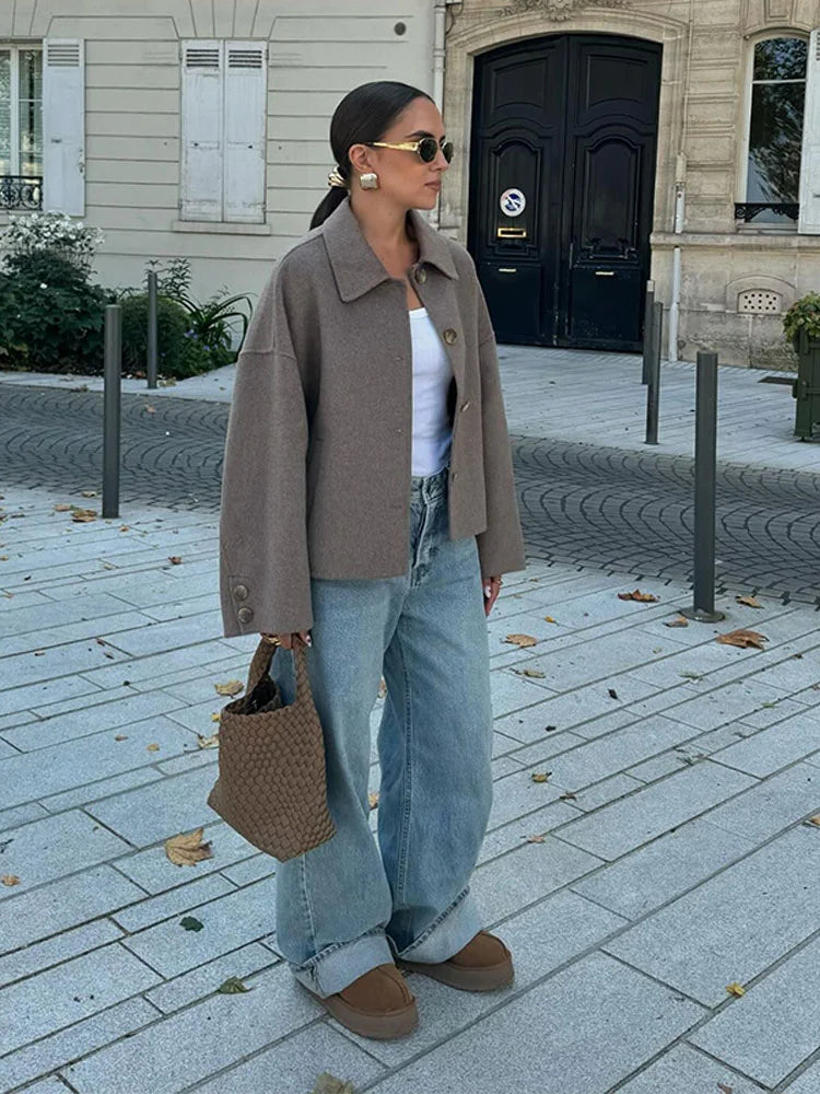 Women's beige cropped jacket with spread collar and button fastening