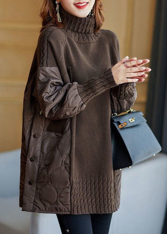 Women's longline turtleneck sweater with quilted patchwork sleeves and side panels