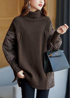 Women's longline turtleneck sweater with quilted patchwork sleeves and side panels