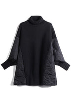 Women's longline turtleneck sweater with quilted patchwork sleeves and side panels