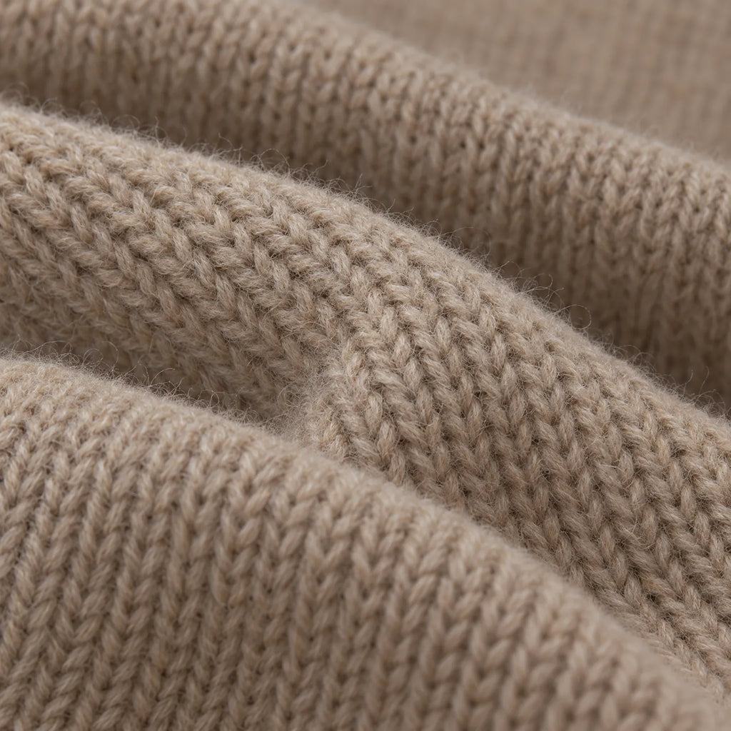 Women's asymmetric button front knitted cardigan with long sleeves and ribbed trims