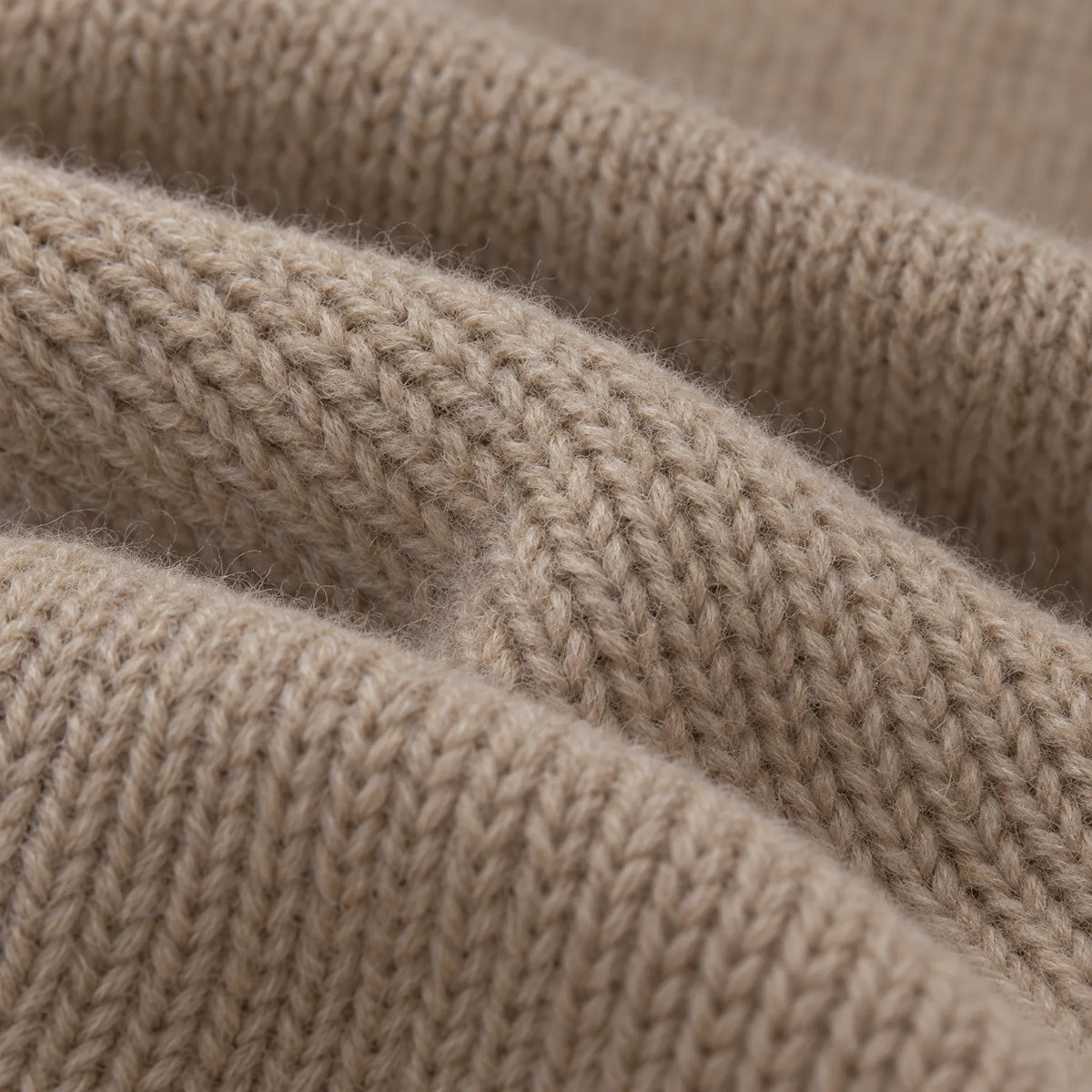 Women's asymmetric button front knitted cardigan with long sleeves and ribbed trims