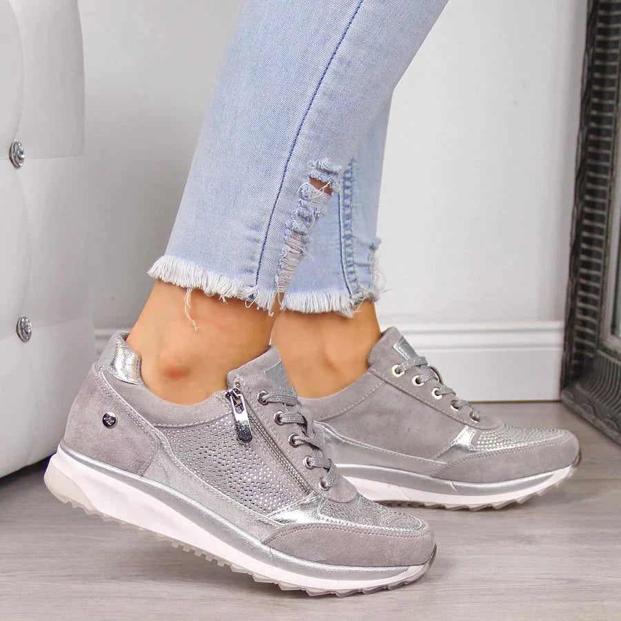 Women's low-top trainers with lace-up fronts, side zips, textured panels and flat ridged soles