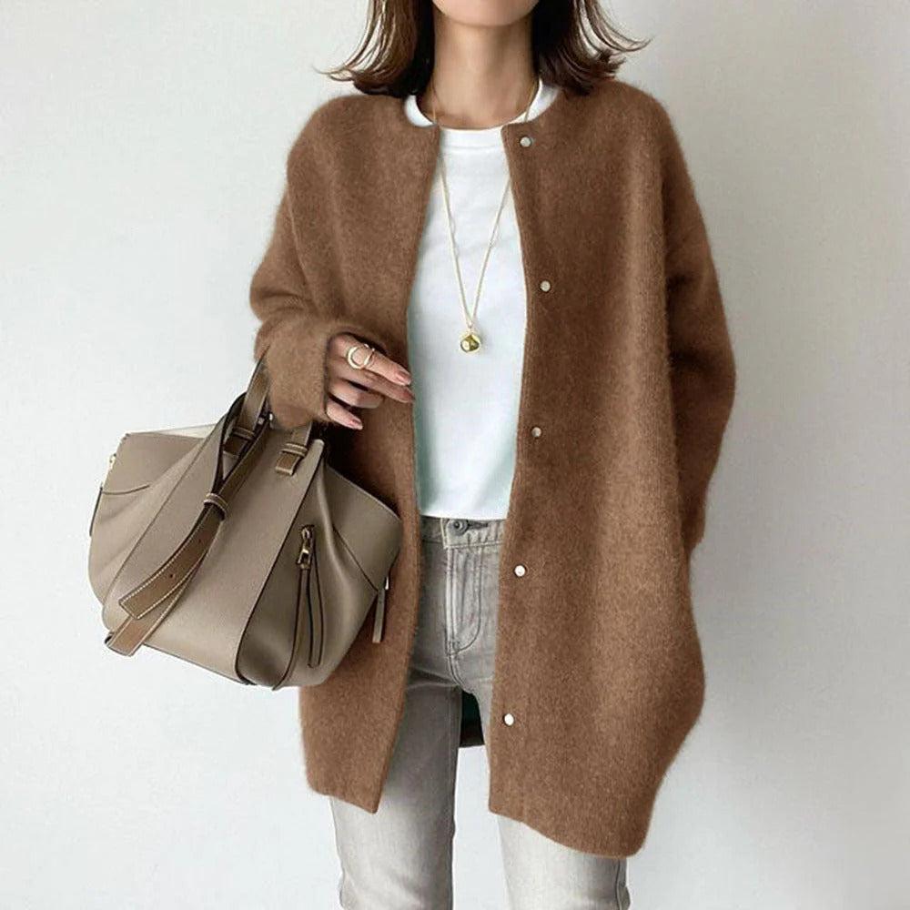 Women's relaxed fit long coat with round neck, long sleeves and snap buttons