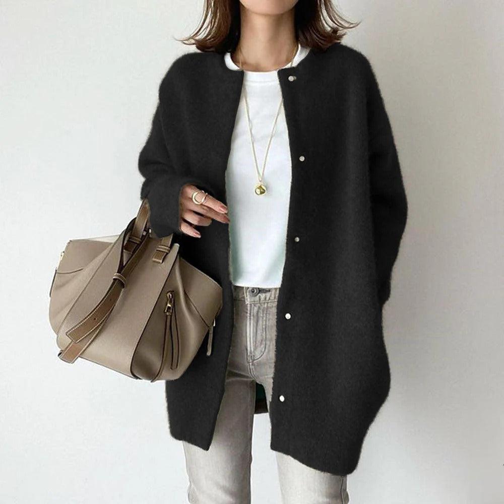 Women's relaxed fit long coat with round neck, long sleeves and snap buttons