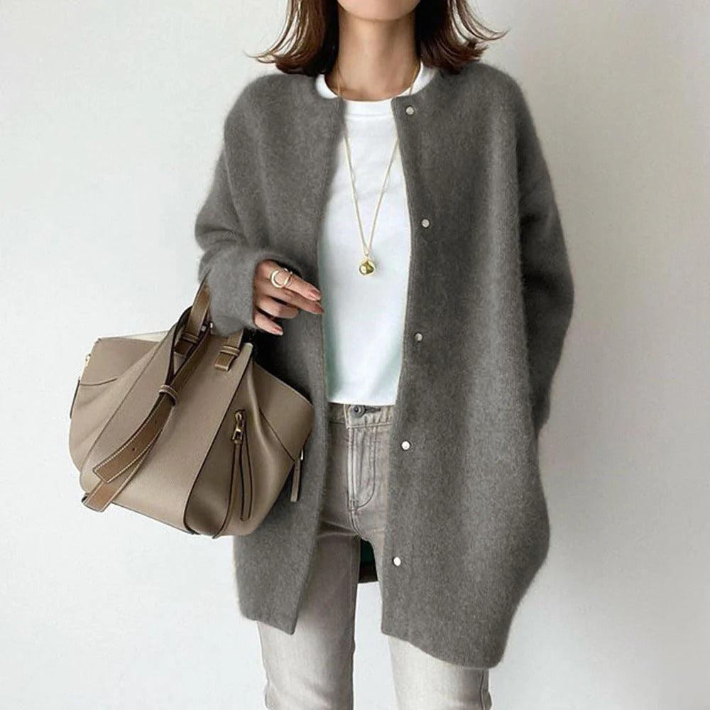 Women's relaxed fit long coat with round neck, long sleeves and snap buttons