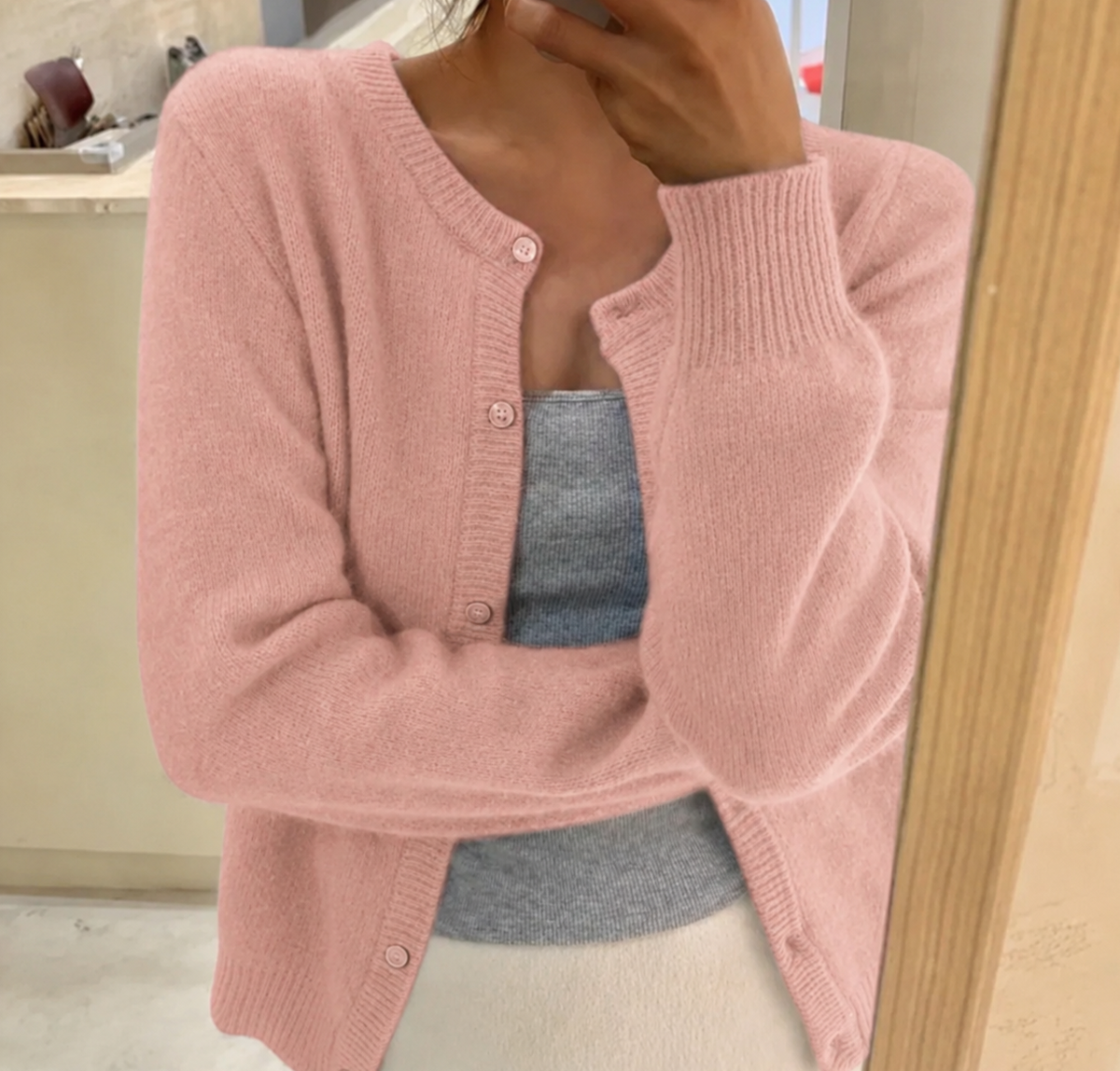 Women's plain knitted cardigan with round neck, long sleeves and button front