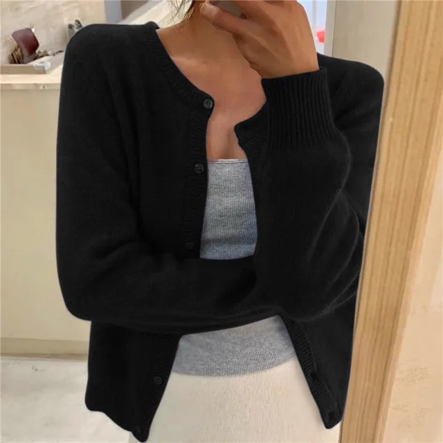 Women's plain knitted cardigan with round neck, long sleeves and button front