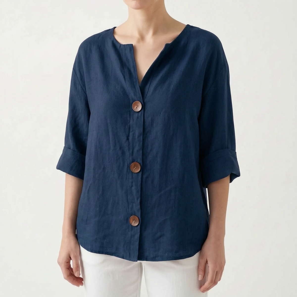 Women's orange V-neck button-down blouse with rolled three-quarter sleeves