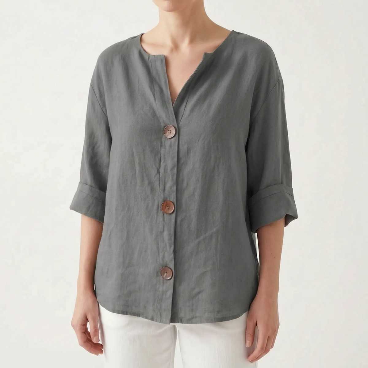 Women's orange V-neck button-down blouse with rolled three-quarter sleeves