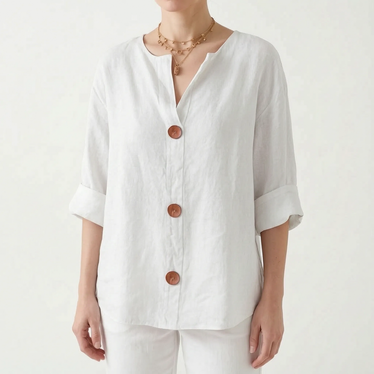 Women's orange V-neck button-down blouse with rolled three-quarter sleeves