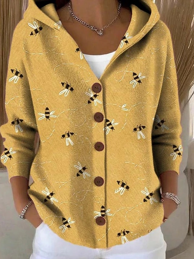 Women's hooded button cardigan shown in multicoloured patchwork and bee motif designs