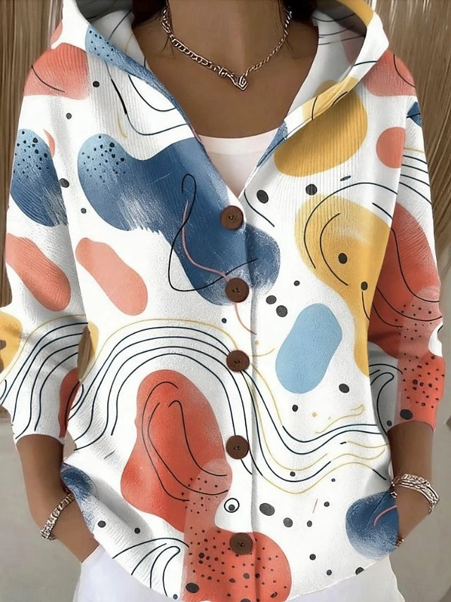 Women's hooded button cardigan shown in multicoloured patchwork and bee motif designs