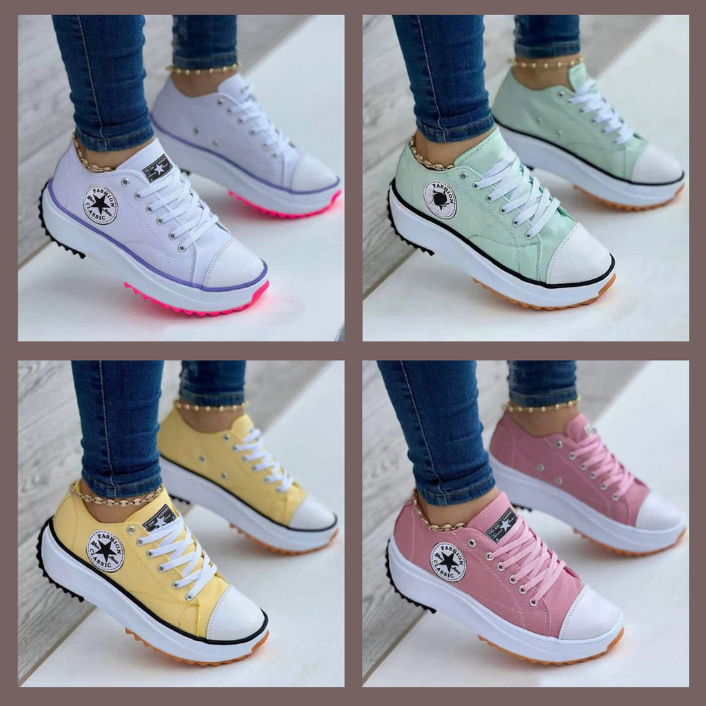 Women's low-top lace-up trainers with panelled uppers, side patches and flat ridged soles