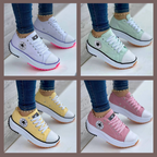 Women's low-top lace-up trainers with panelled uppers, side patches and flat ridged soles