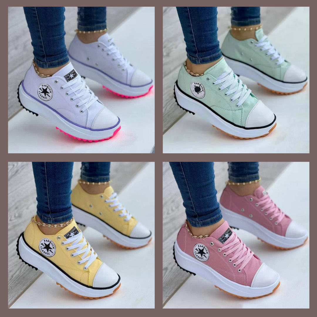 Women's low-top lace-up trainers with panelled uppers, side patches and flat ridged soles