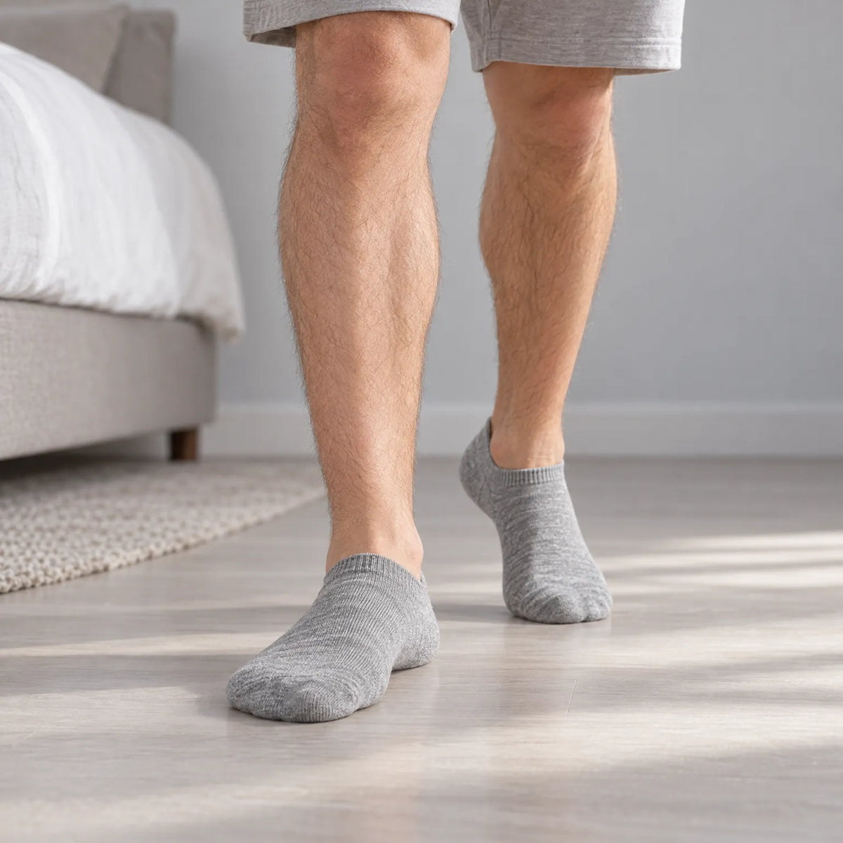 Unisex low-cut ribbed trainer socks shown in grey and white