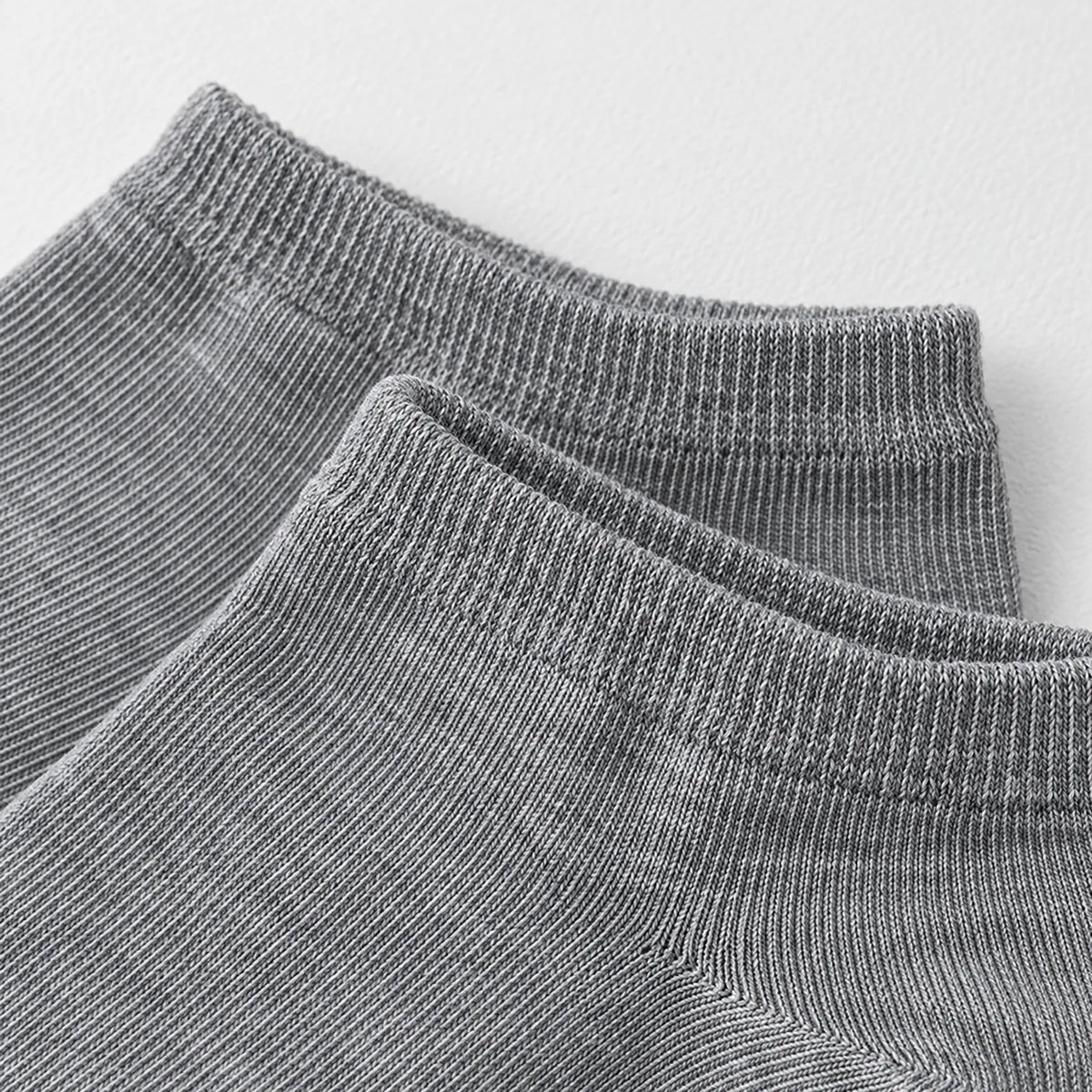 Unisex low-cut ribbed trainer socks shown in grey and white
