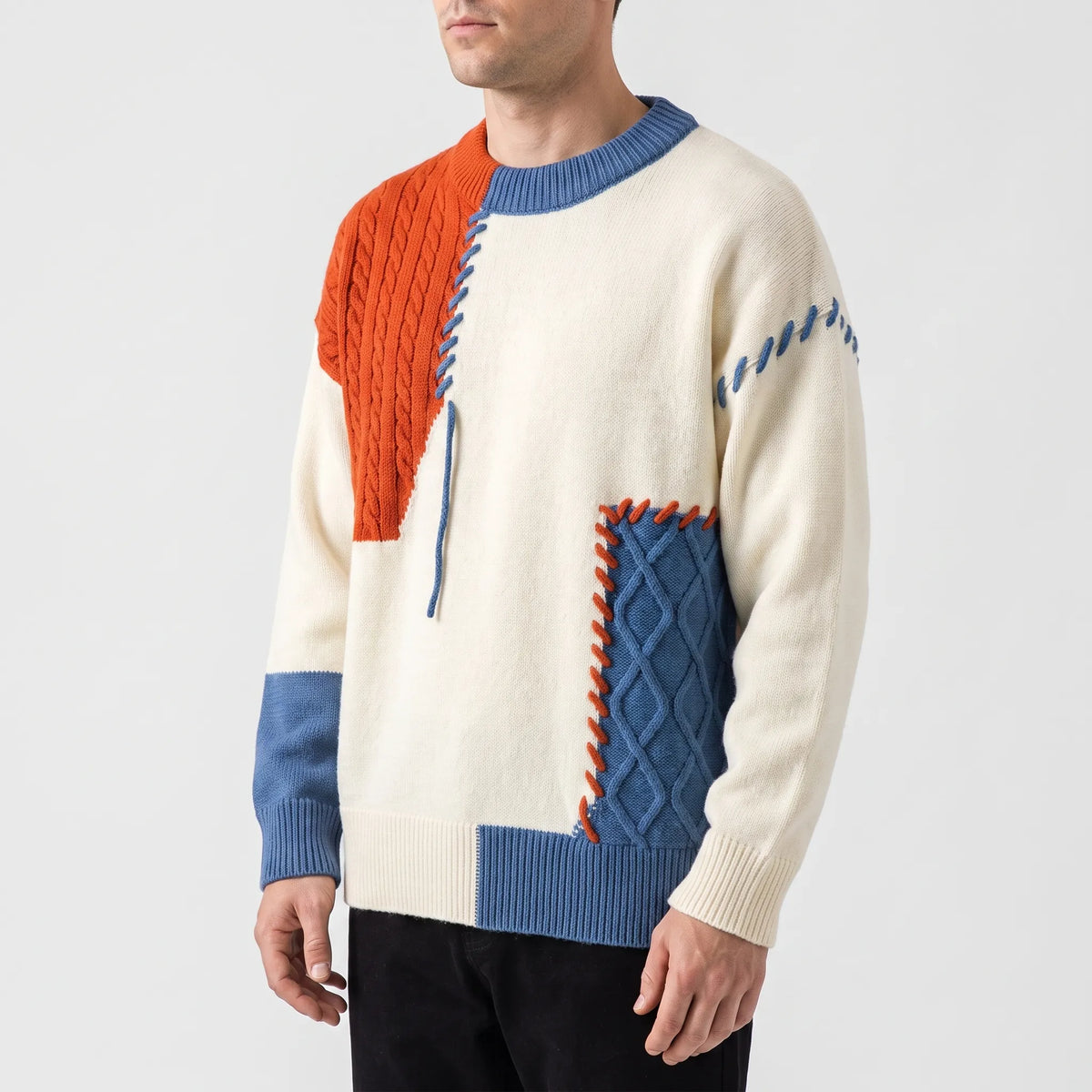 Men's patchwork cable knit jumper with contrasting panels and stitched details