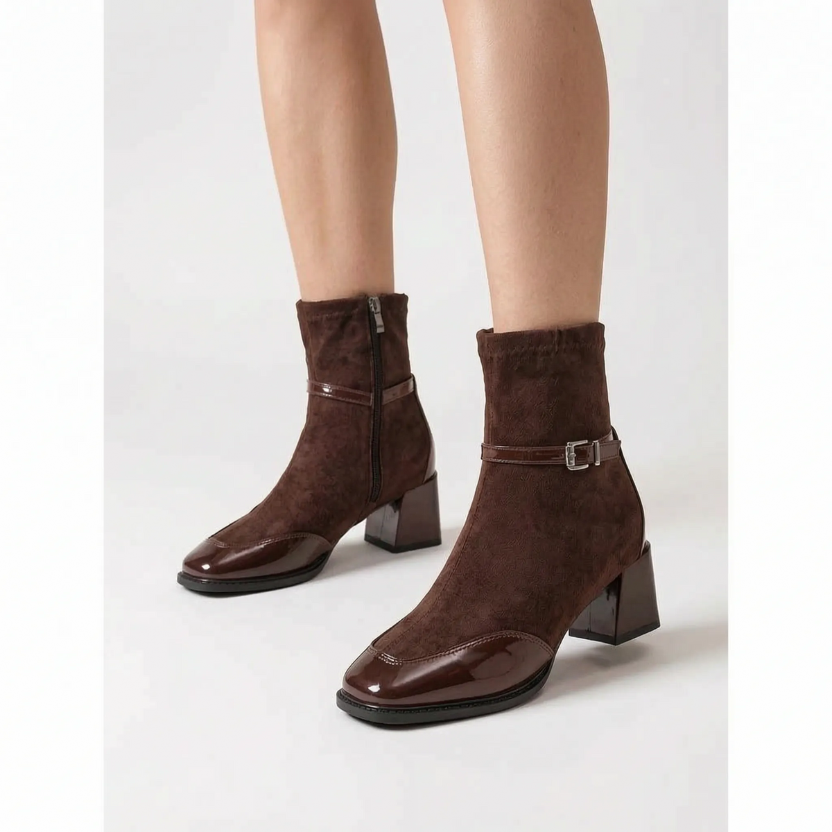 Women's heeled ankle boots with square toes, buckle straps and glossy toe panels