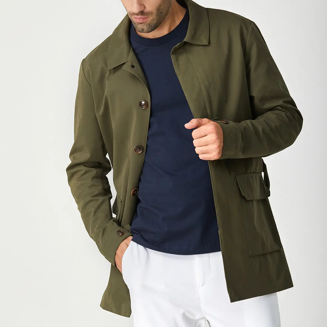 Green men's short trench coat with long sleeves, button front and flap pockets