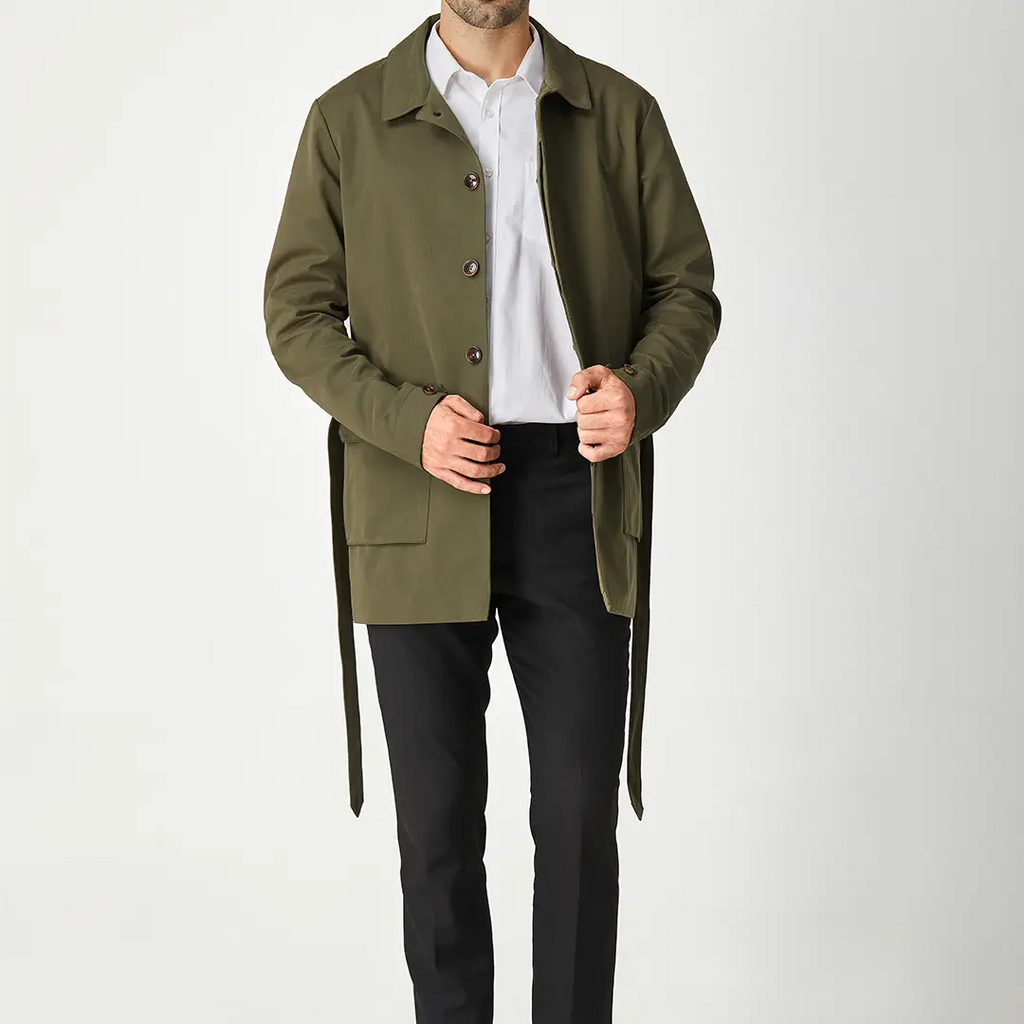 Green men's short trench coat with long sleeves, button front and flap pockets