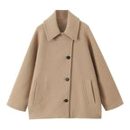 Women's oversized short coat with wide collar, long sleeves, buttons and front pockets