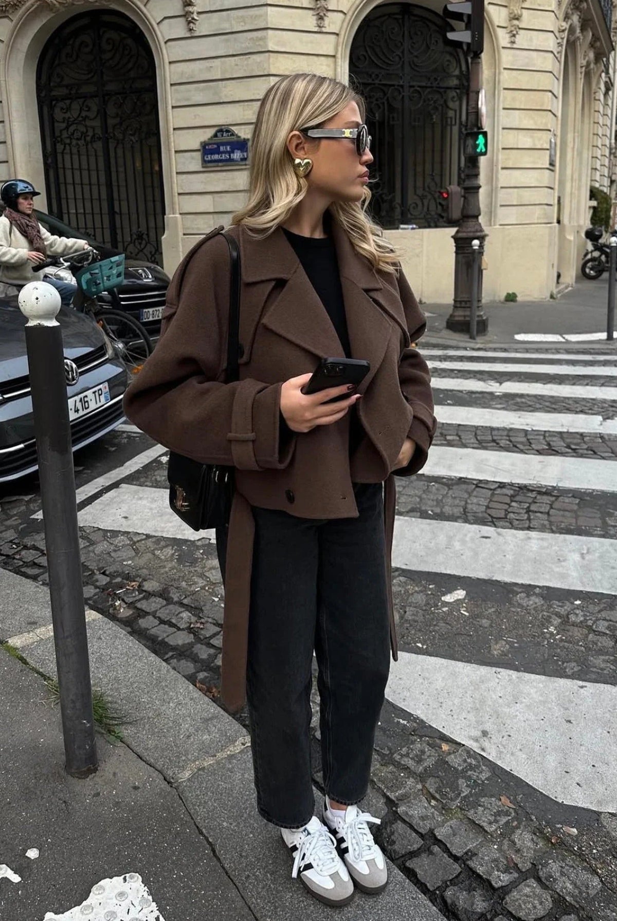 Women's brown cropped jacket with lapels, buttons and long belt