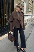 Women's brown cropped jacket with lapels, buttons and long belt