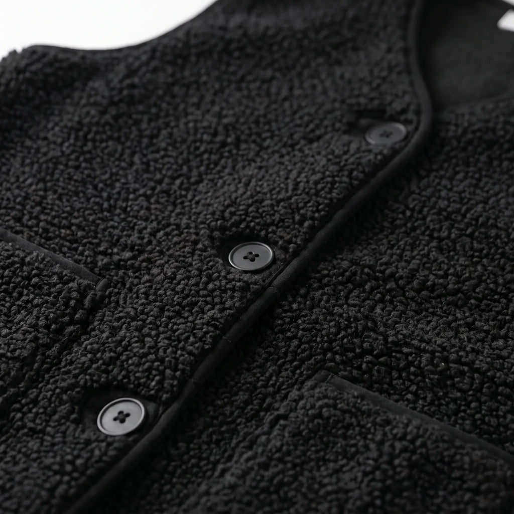 Women's textured teddy gilet with V-neck, button front and large patch pockets