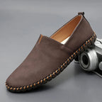 Unisex slip-on loafers with rounded toes and woven sole trim