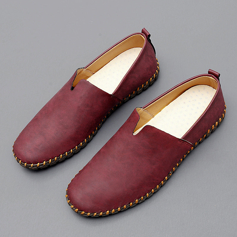 Unisex slip-on loafers with rounded toes and woven sole trim