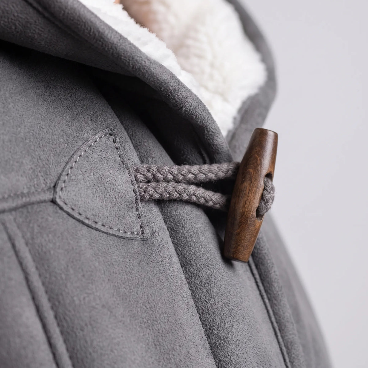 Women's hooded duffle coat with toggle fastenings and contrasting lining